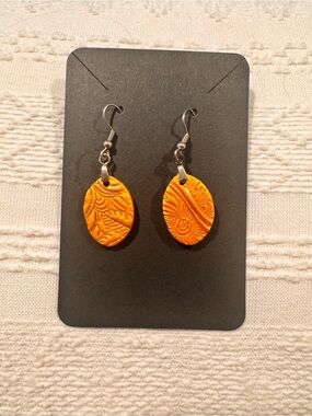Handcrafted Textured Oval Dangle Earrings in golden color